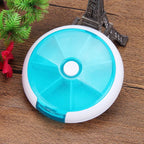 7-Compartment Round Pill Organizer, Portable Plastic Medicine Storage Case with Rotating Dispenser, Compact and Easy-to-Carry Design, Ideal for Daily Vitamins, Travel, and Home Use